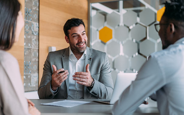 A business person reviewing their business insurance coverage on the computer
